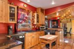 Fully equipped kitchen with gas range with four burners